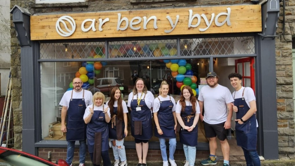 A photograph of the team celbrating the opening day